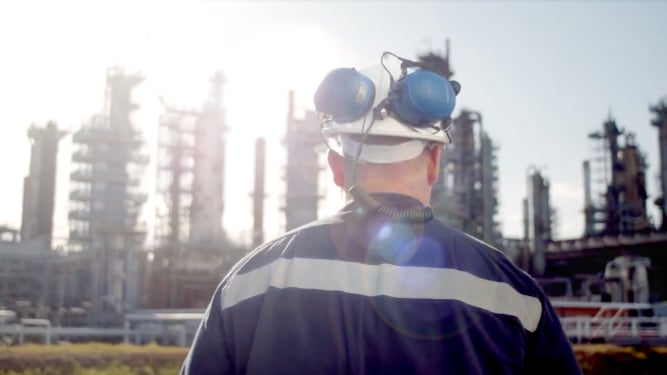 Worker looking at building site